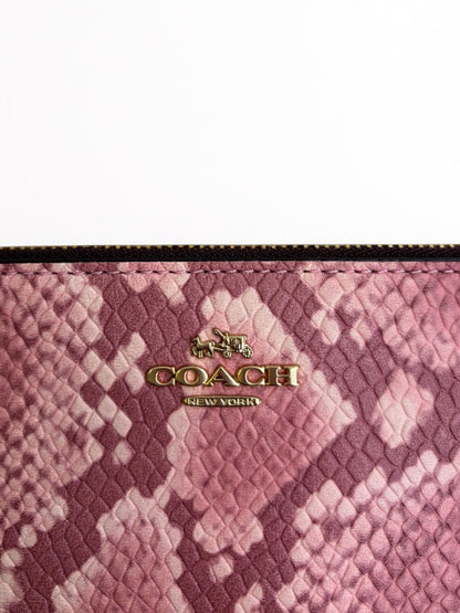 Coach snake skin Clutch in pink