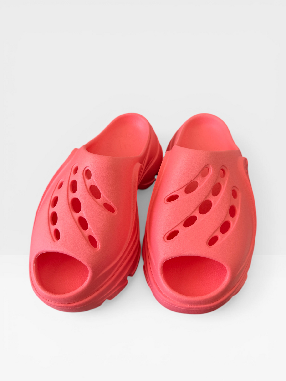 Adidas by Stella McCartney chunky clog sandals in neon coral, top view with cut-out ventilation