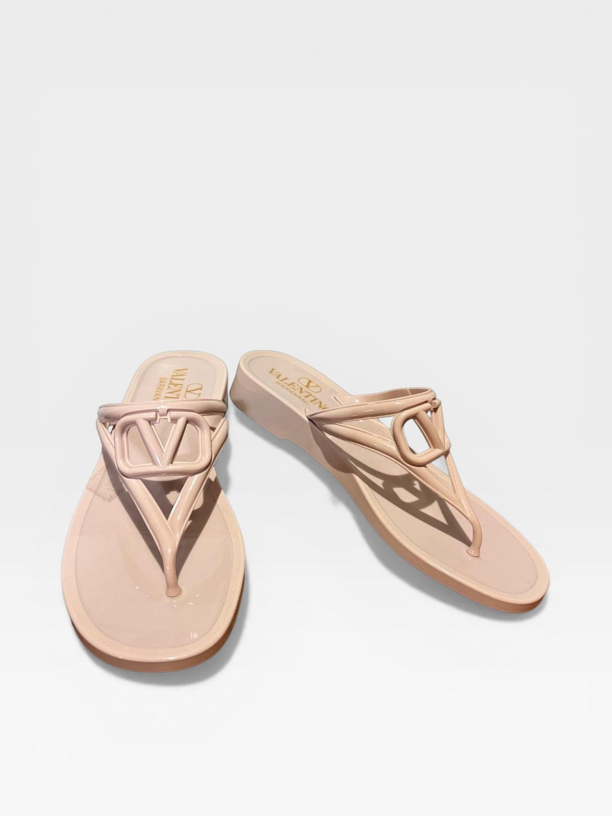 Valentino Garavani VLogo jelly thong sandals in blush pink, side view — preloved designer