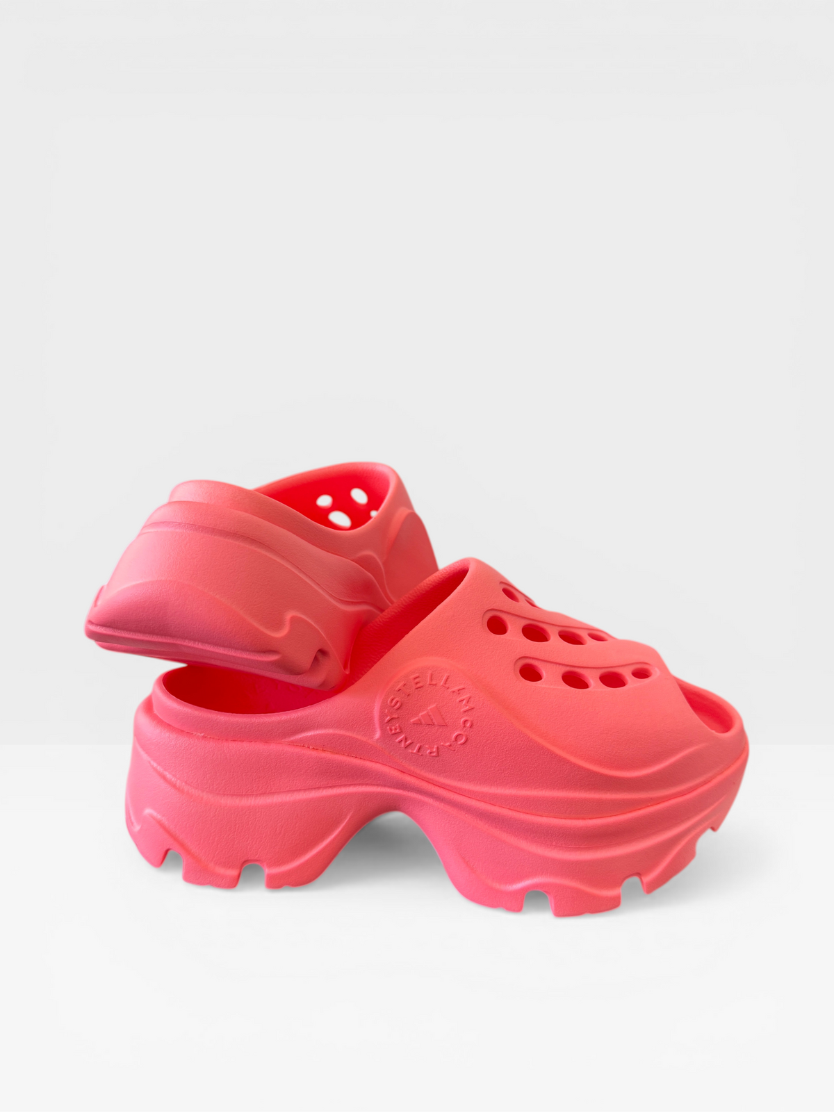 Adidas by Stella McCartney chunky clog sandals in neon coral, front pair view — size 37