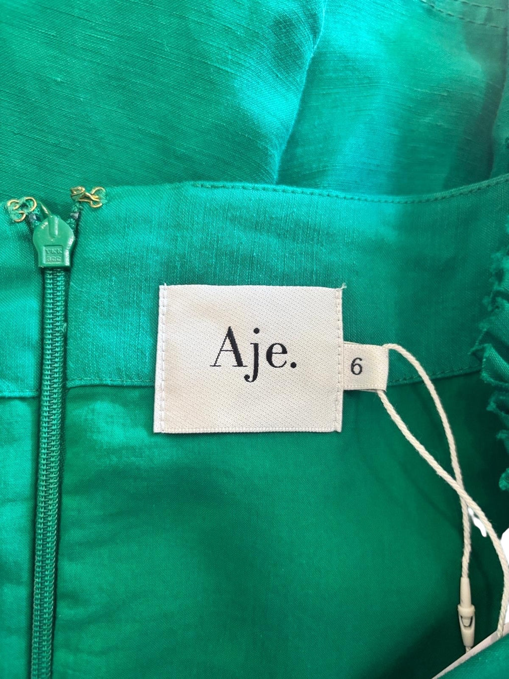 Aje Dusk Knot Puff Sleeve Mini Dress in emerald green, side view — size 6