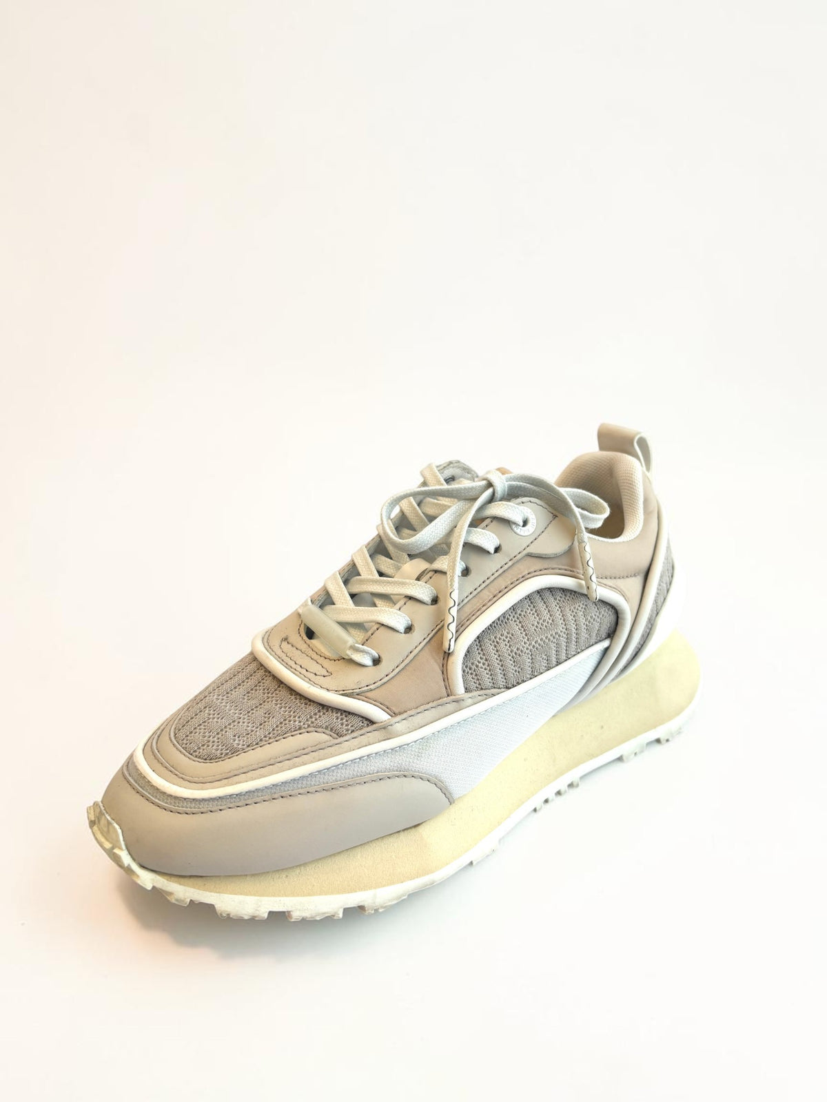 Balmain B-Racer sneakers in beige, side profile showing chunky sculptural rubber sole
