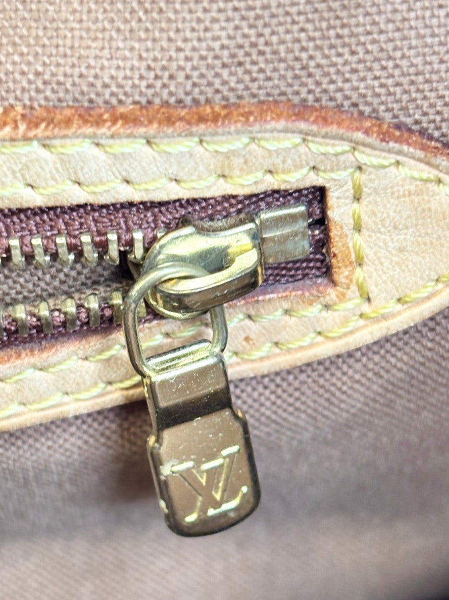 Louis Vuitton monogram canvas tote leather handles and top seam detail, showing authentic patina