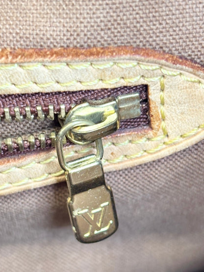 Louis Vuitton monogram canvas tote leather handles and top seam detail, showing authentic patina