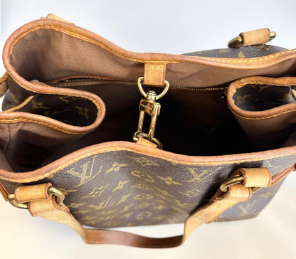 LV Batignolles Vertical monogram tote, side profile displaying bag depth and tan leather trim