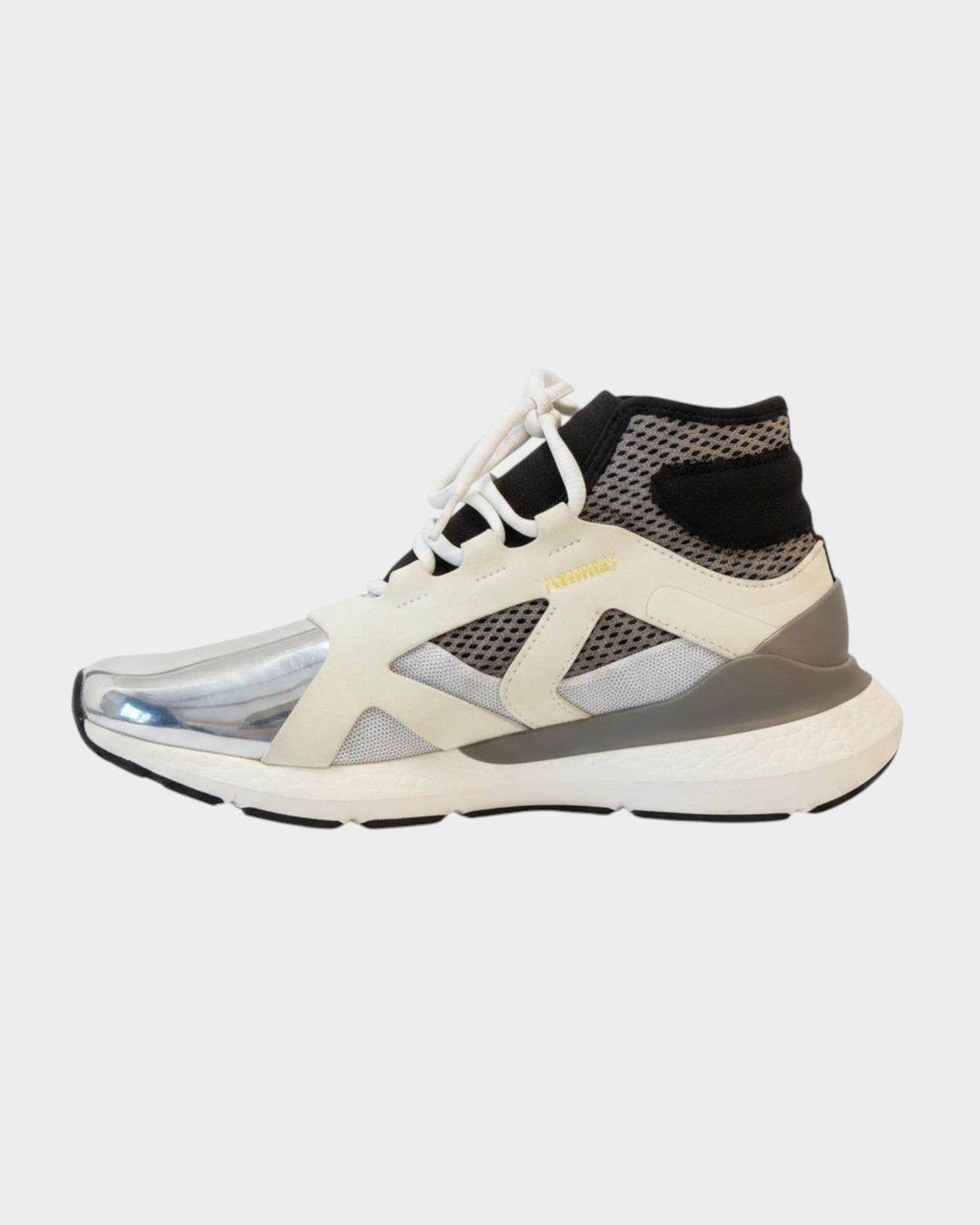 Lula and Mimi Adidas x Stella McCartney Ultraboost sneakers in white and black with a metallic silver toe cap.
