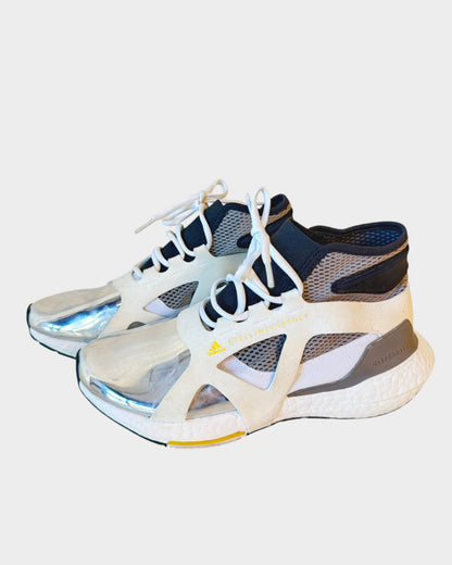 Lula and Mimi Adidas x Stella McCartney Ultraboost sneakers with white mesh, black accents, and silver metallic toe caps.
