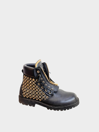 Lula and Mimi black leather army boots featuring gold-tone eyelet studs and a front zip closure.