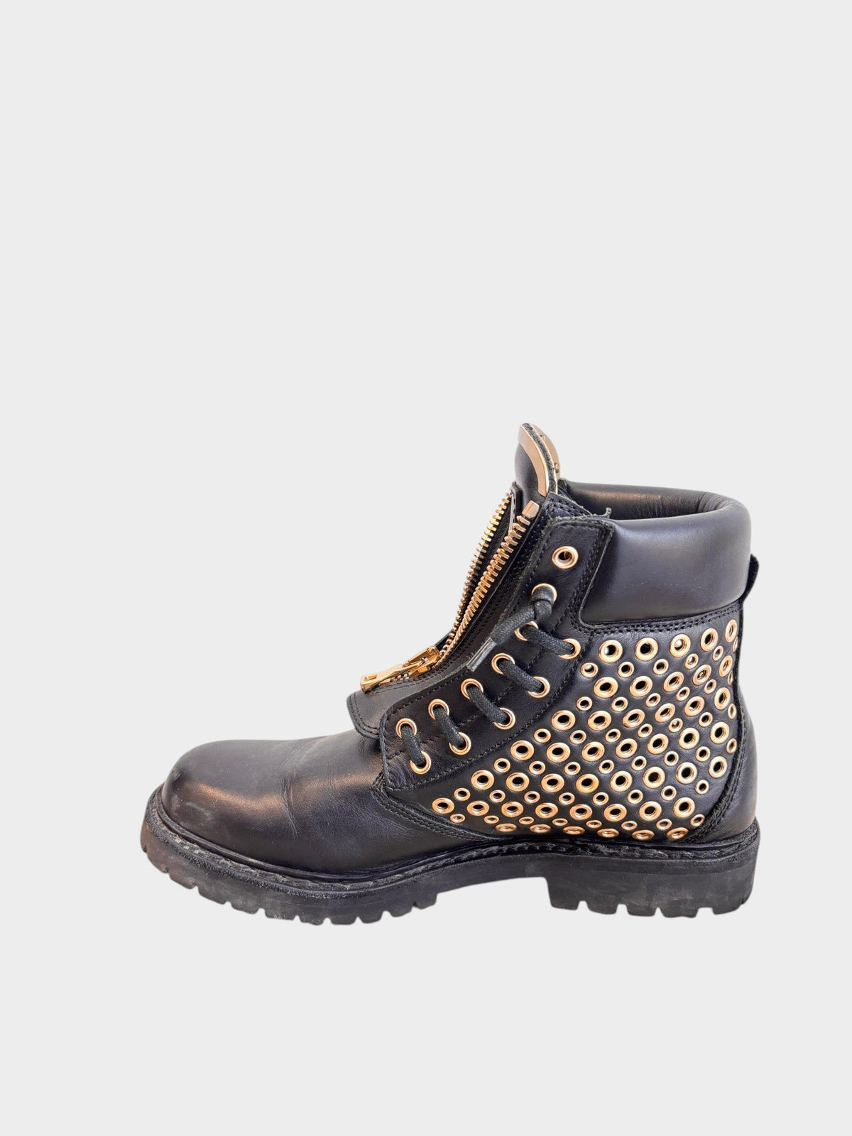Lula and Mimi black leather army boots featuring gold-tone metal eyelet studs and a front zip closure.