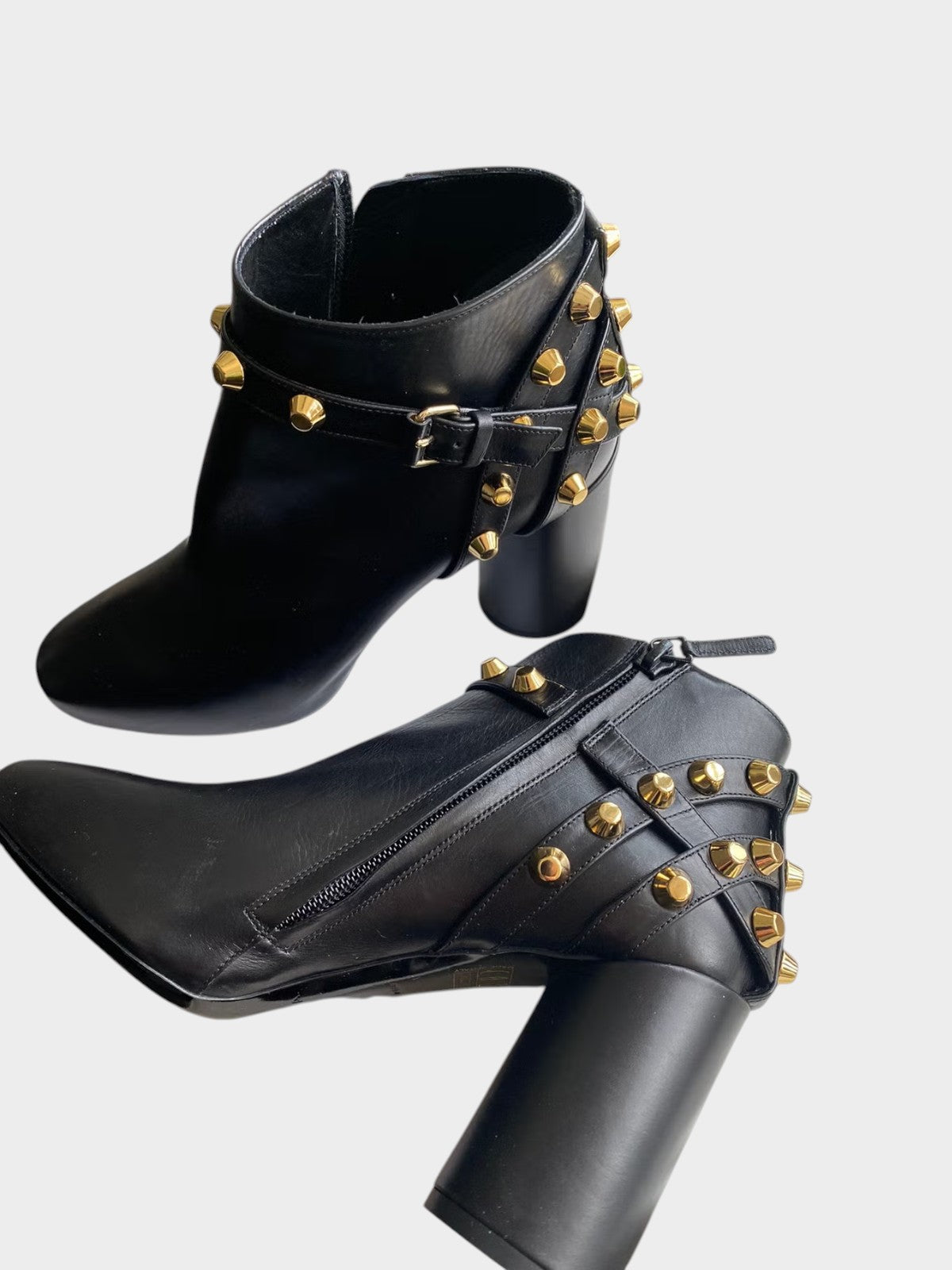 Lula and Mimi black leather ankle boots featuring gold-tone pyramid studs, buckled straps, and a block heel.