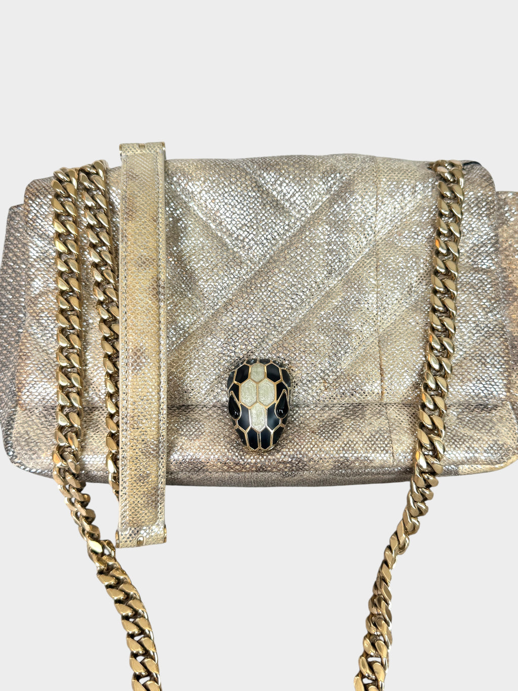 Lula and Mimi Bvlgari Serpenti Cabochon small shoulder bag in metallic Milky Opal Beige karung skin with snake clasp.