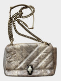 Lula and Mimi Bvlgari Serpenti Cabochon small shoulder bag in metallic Milky Opal Beige karung skin with snake clasp.