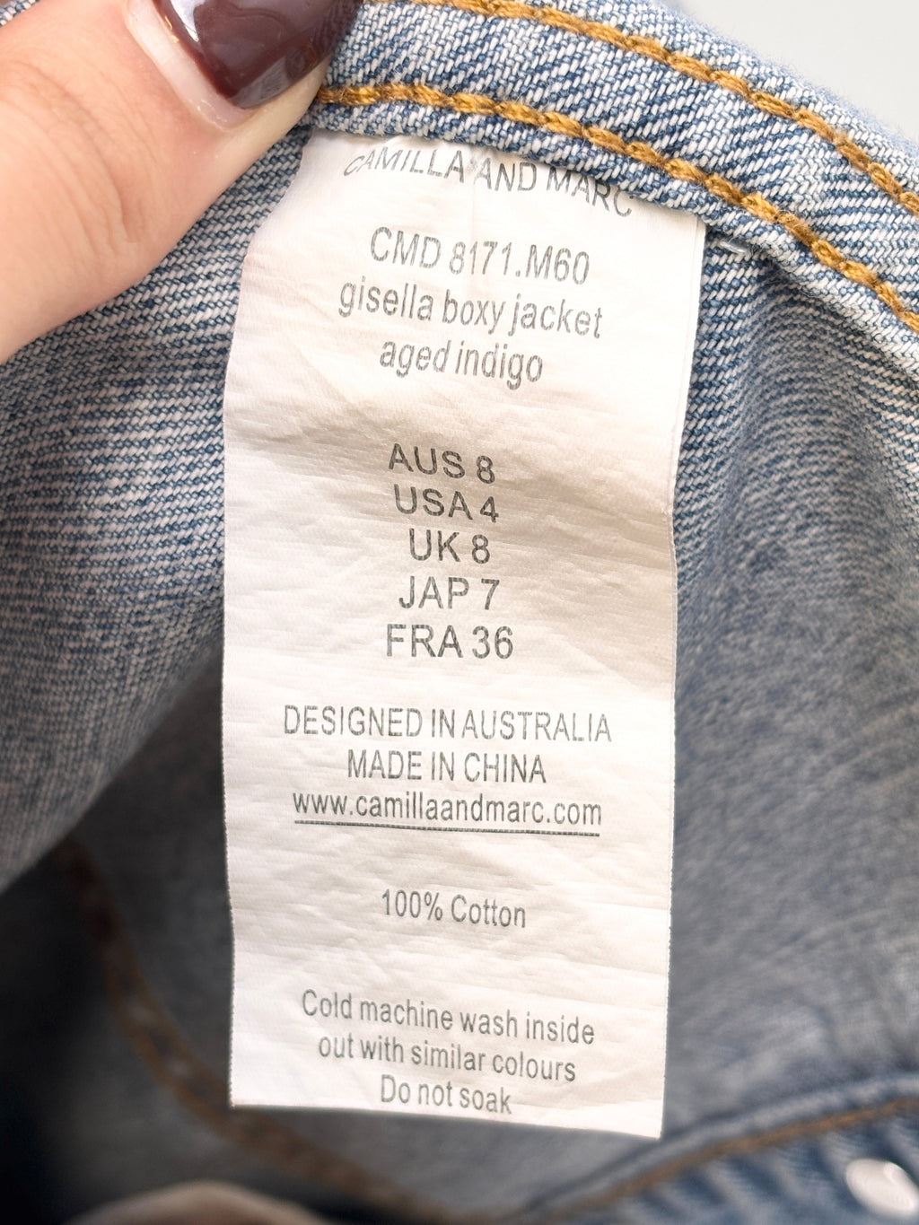 Lula and Mimi Camilla and Marc Sadie denim jacket interior care label showing size 8 and 100% cotton composition