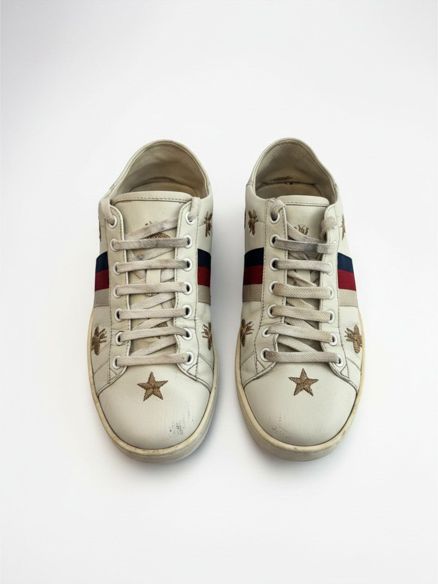 Lula and Mimi Gucci Ace white leather sneakers featuring gold bee and star embroidery with Sylvie web stripe detail.
