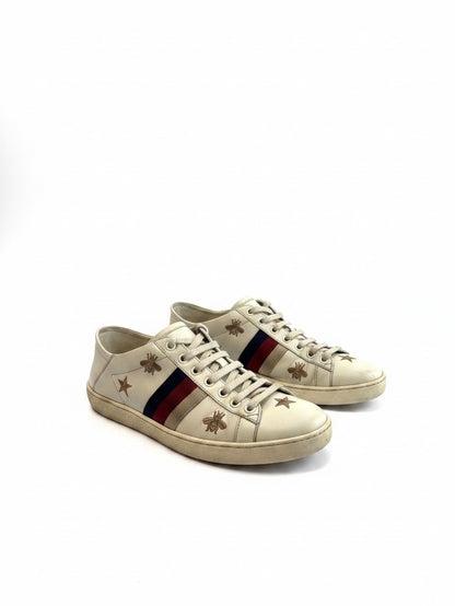 Lula and Mimi pre-owned white leather Gucci Ace sneakers with gold bee and star embroidery and Sylvie web stripe.