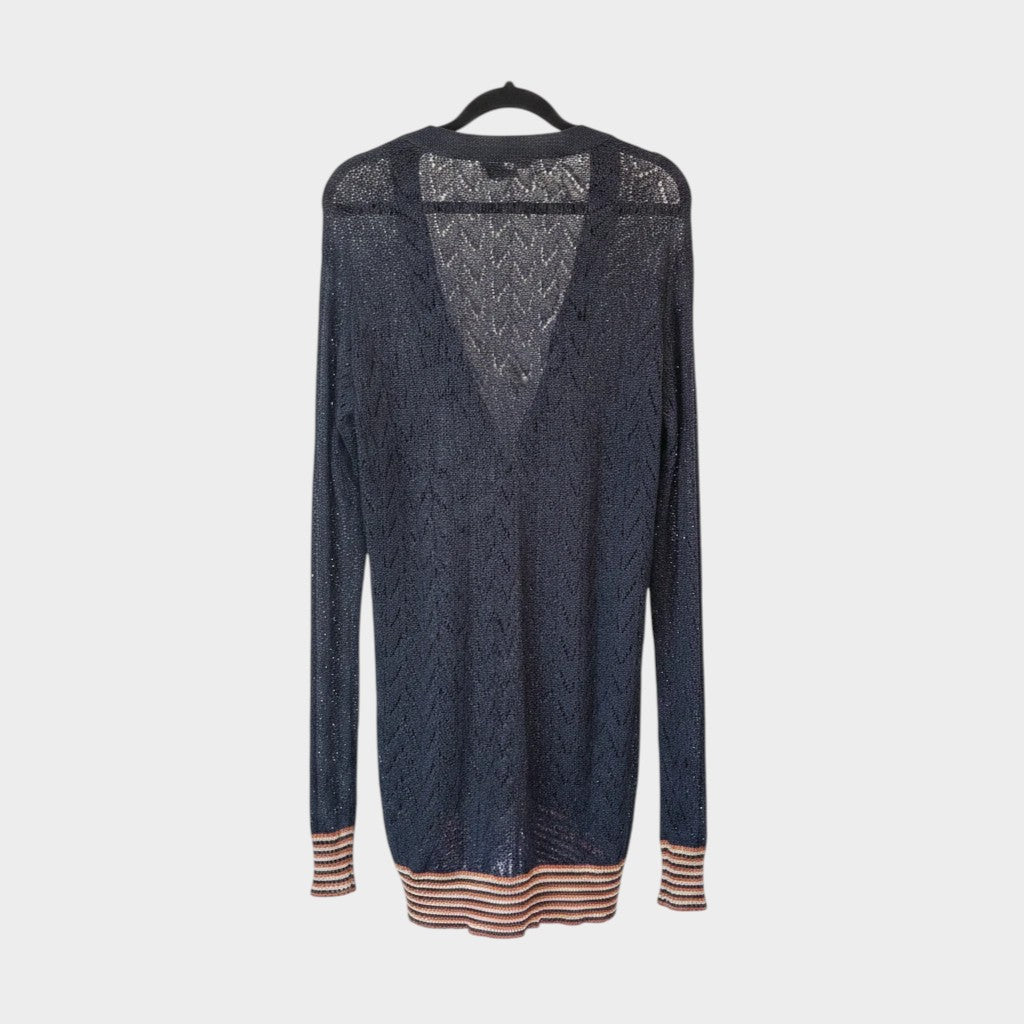 Lula and Mimi Kate Sylvester black luxury yarn cardigan with v-neck and striped cuffs hanging on a black hanger