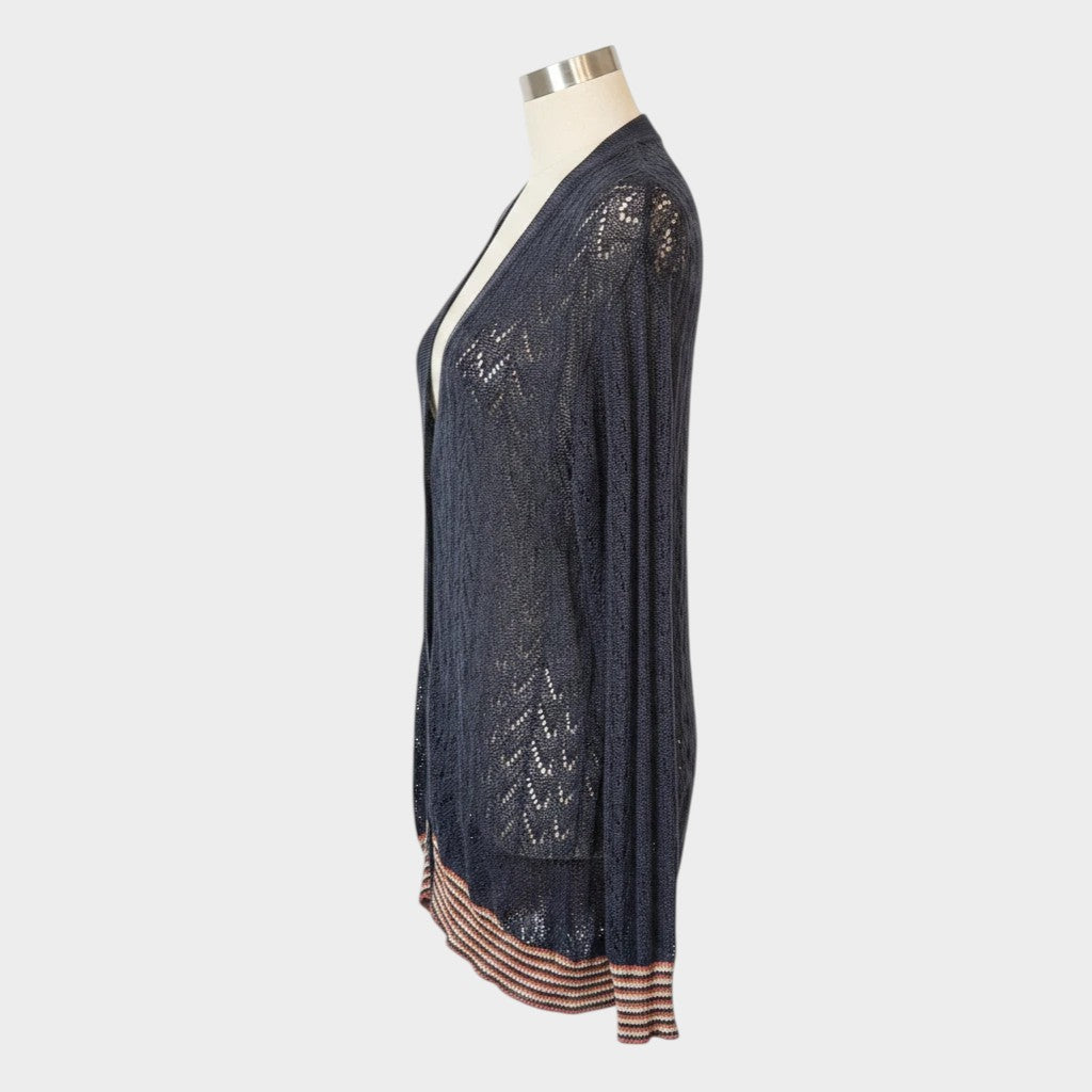 Lula and Mimi Kate Sylvester black luxury yarn cardigan with open knit detailing and striped hem, side view