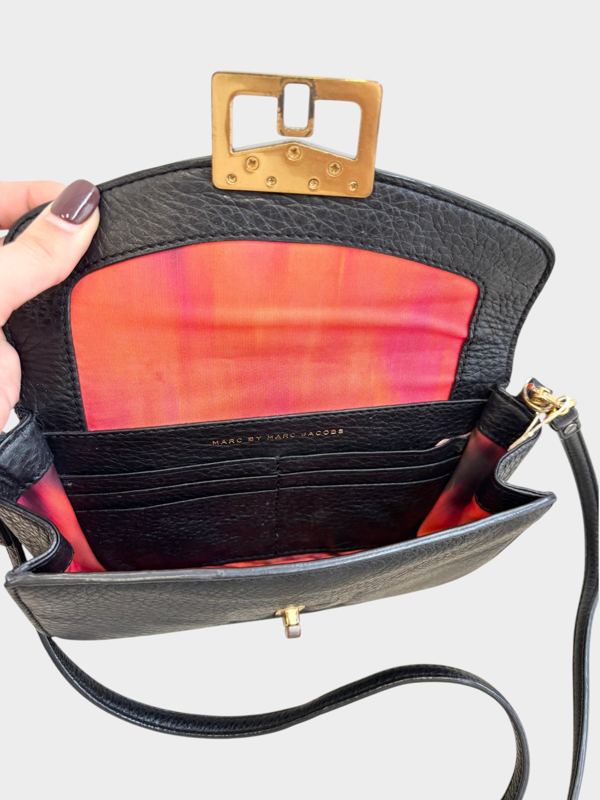 Lula and Mimi Marc Jacobs Bianca Jane black leather crossbody bag with gold hardware and vibrant pink interior lining