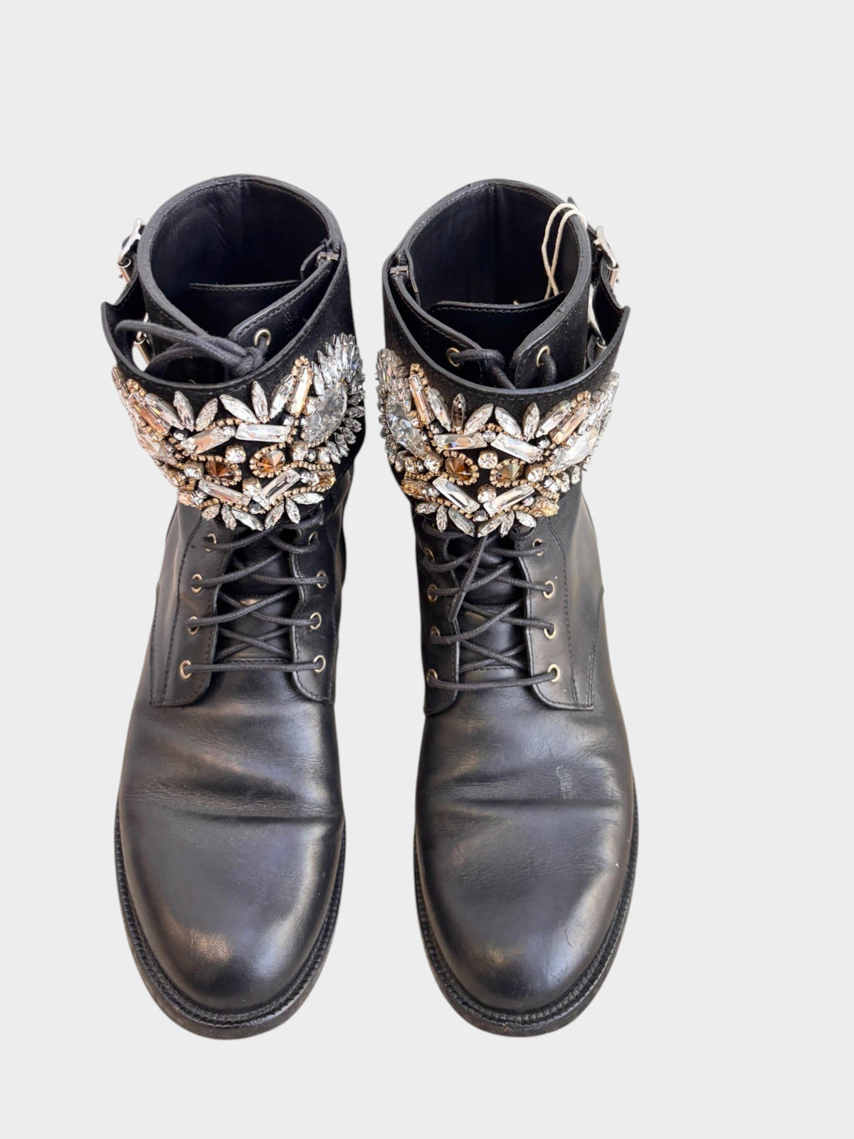 Lula and Mimi Rene Caovilla black leather moto boots featuring crystal embellishments, lace-up front, and side zip.