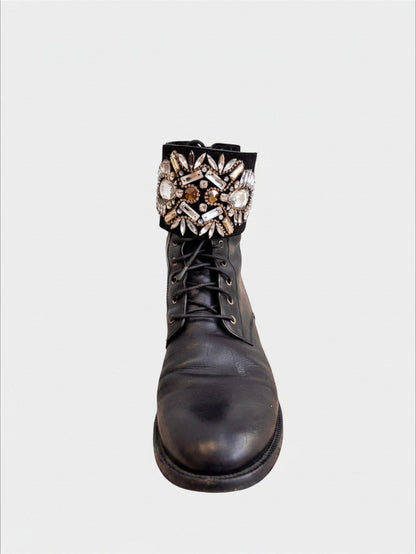 Lula and Mimi Rene Caovilla black leather moto boots featuring a crystal-embellished cuff and lace-up front.
