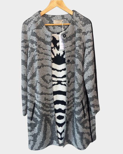 Lula and Mimi Thurley longline knit coat in a grey and black animal print with front buttons and side pockets.
