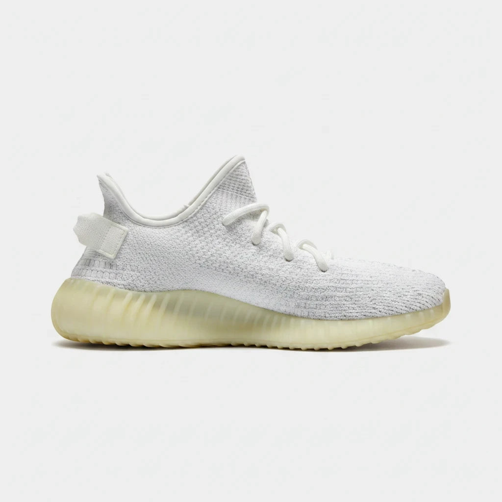 Lula and Mimi Adidas x Yeezy Boost 350 V2 trainers in cream white with a knit upper and translucent rubber sole.