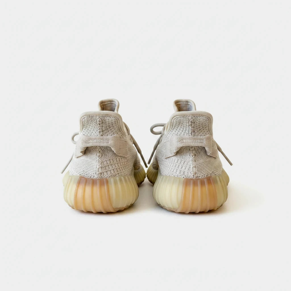 Lula and Mimi Adidas x Yeezy Boost 350 V2 Sesame sneakers in beige Primeknit with signature ribbed gum soles