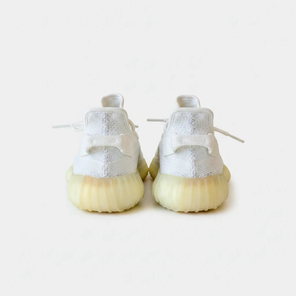 Lula and Mimi Adidas x Yeezy Boost 350 V2 Cream White trainers in white knit with signature heel tabs