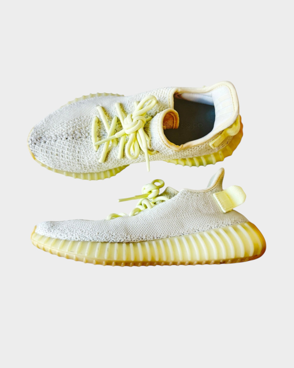 Lula and Mimi Adidas x Yeezy Boost 350 V2 Butter trainers in pale yellow knit fabric with signature rubber soles